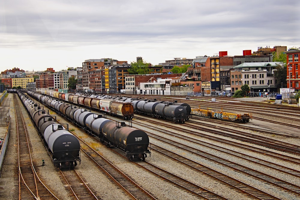 black train on rail road during daytime