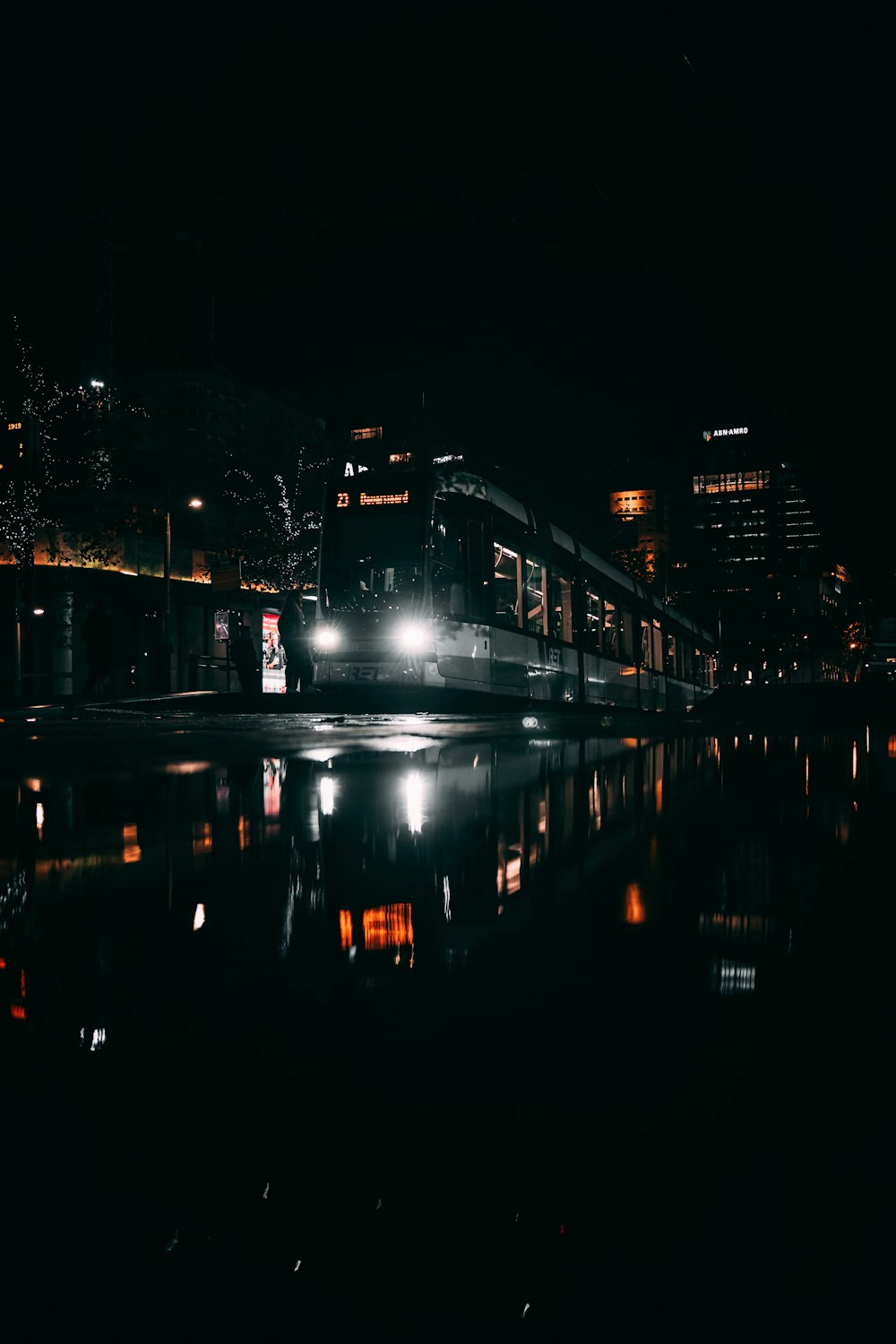 body of water near building during night time