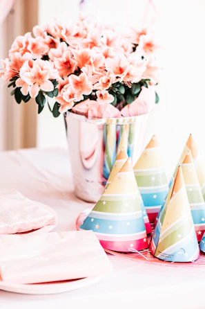 Colorful flower arrangements lining a banquet table at a festive celebration