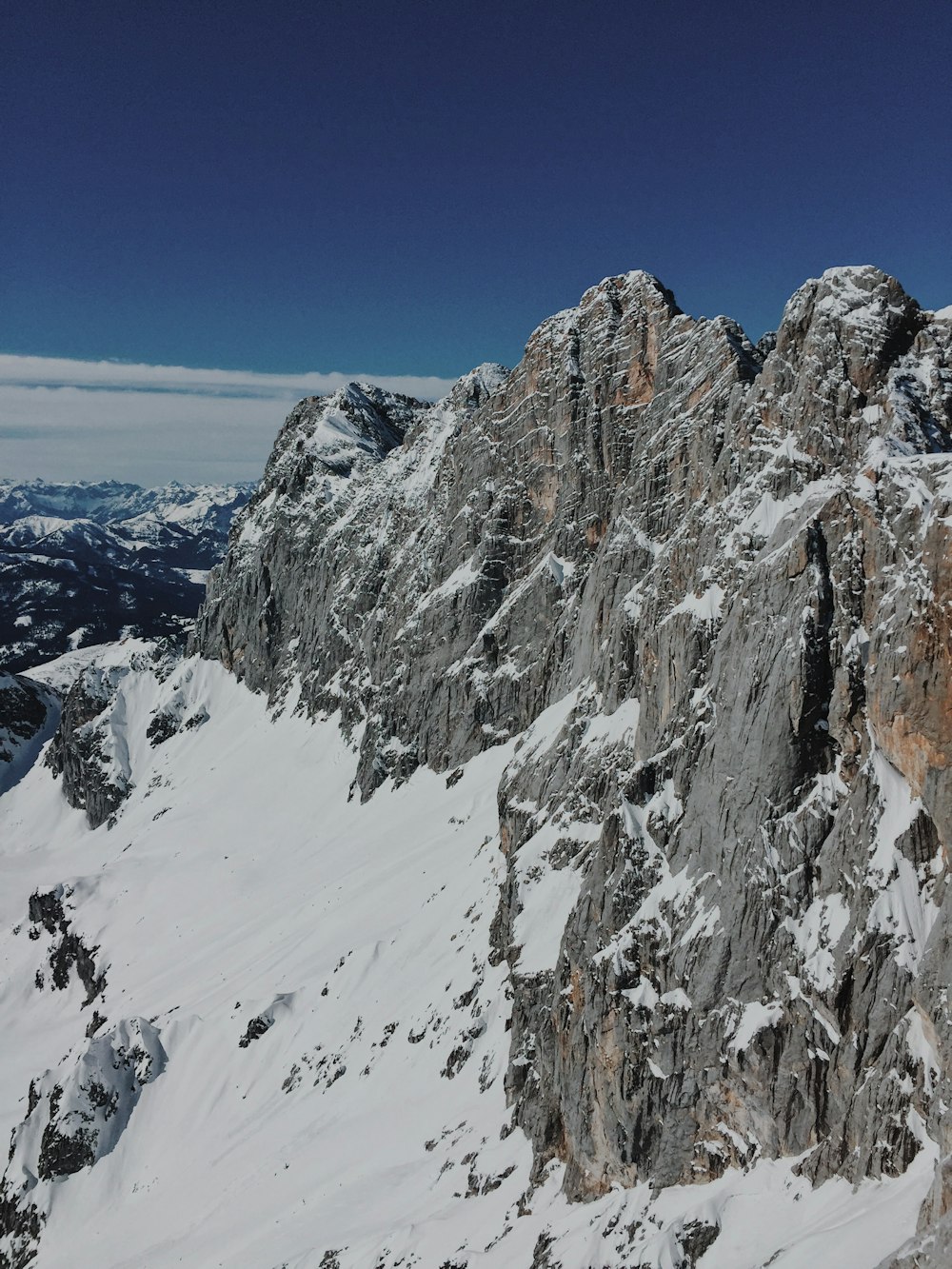 snow covered mountain under blue sky during daytime