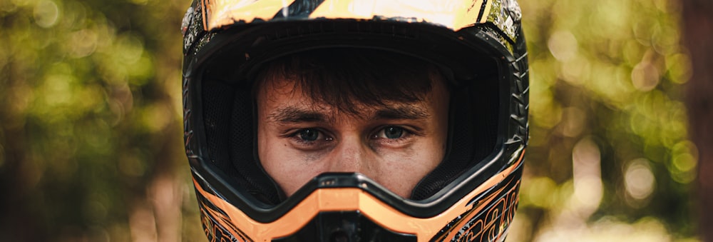 man in black and yellow helmet