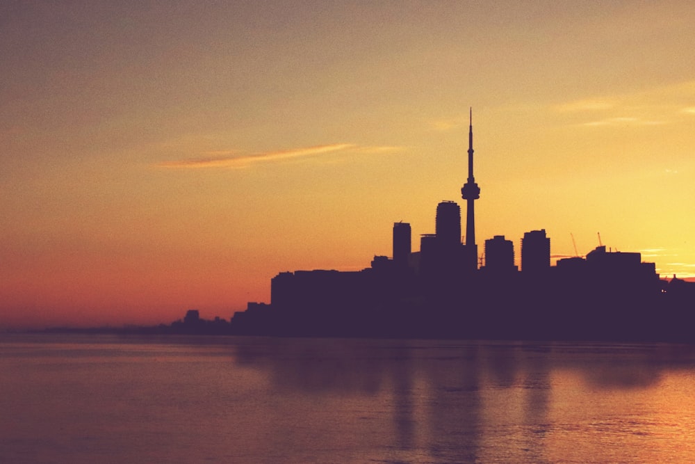 silhouette of city buildings during sunset