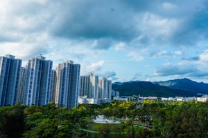 high rise buildings under gray clouds during daytime