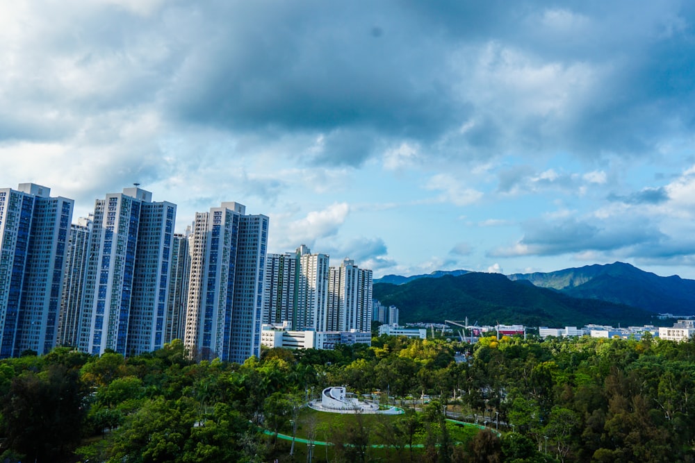 high rise buildings under gray clouds during daytime