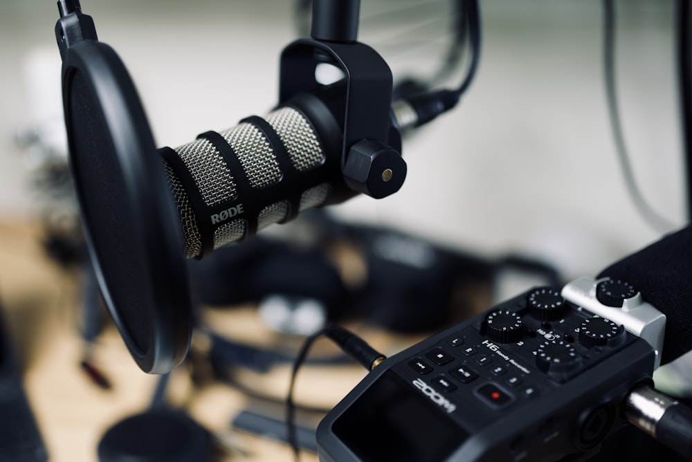 black and gray headphones on black audio mixer