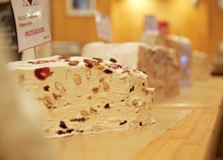 white and brown cake on brown wooden table