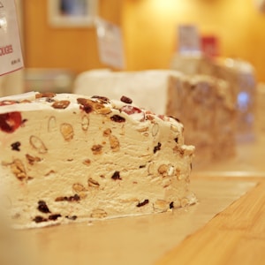 white and brown cake on brown wooden table