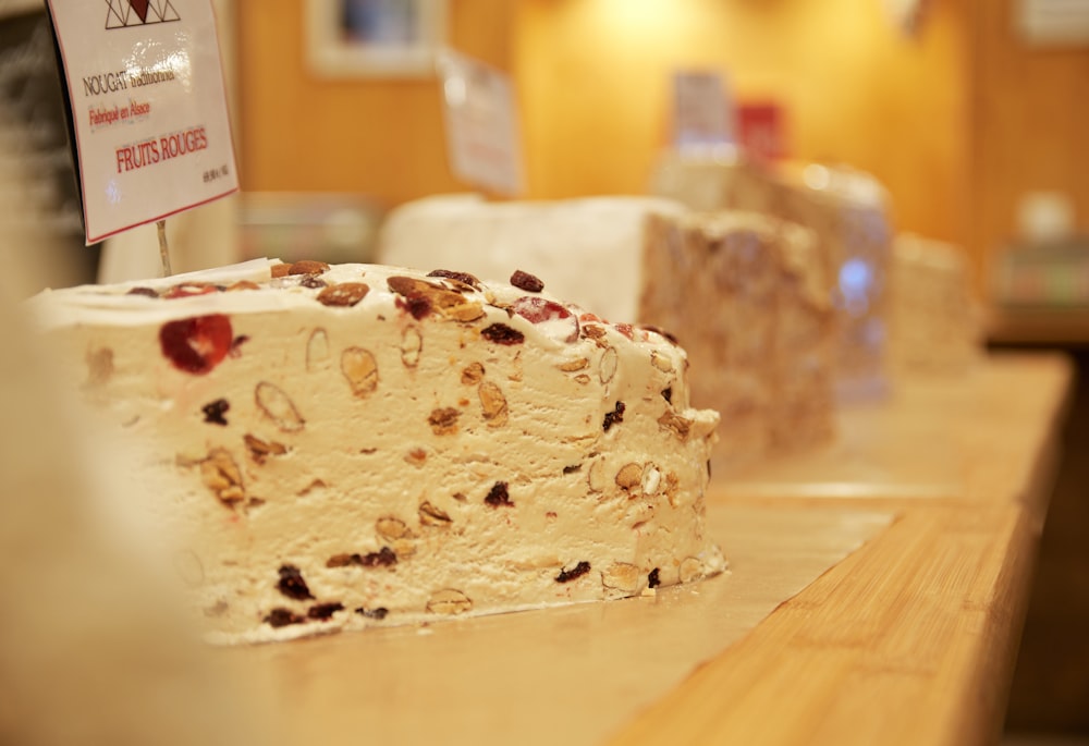 white and brown cake on brown wooden table