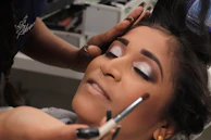 woman lying on bed with white blanket
