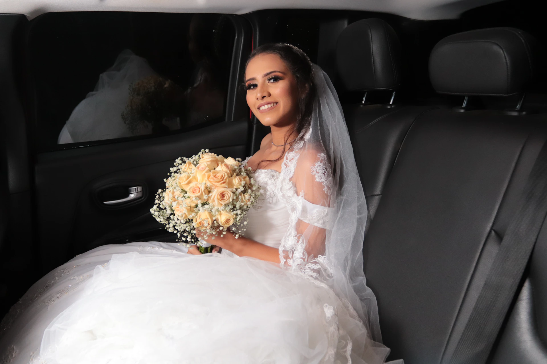 woman in white wedding dress holding bouquet of flowers