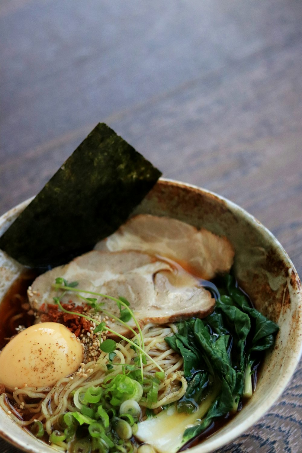 soup with green leaf on white ceramic bowl