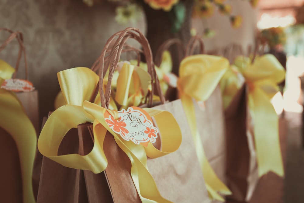 yellow and white ribbon on brown wooden rack