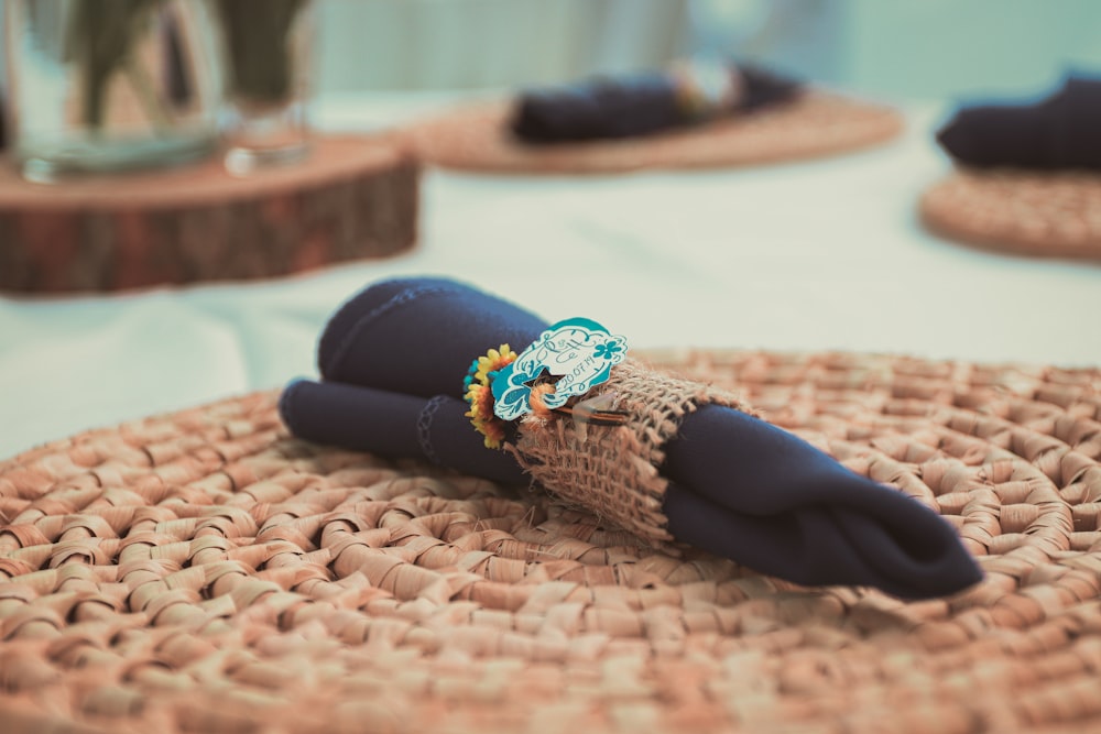 person in blue pants and brown sock lying on brown textile