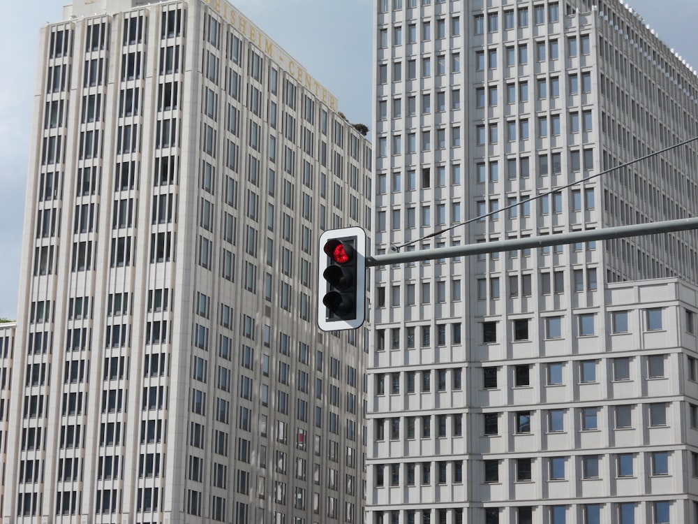 black traffic light on red stop sign