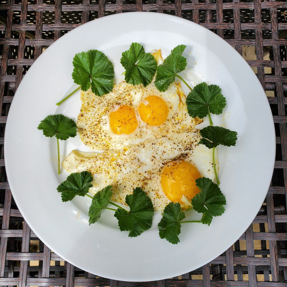 a white plate topped with eggs and parsley