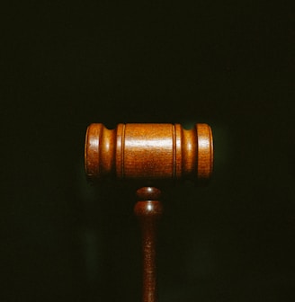 brown wooden stand with black background