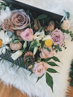 A vibrant bouquet of assorted wedding flowers in soft pastels.