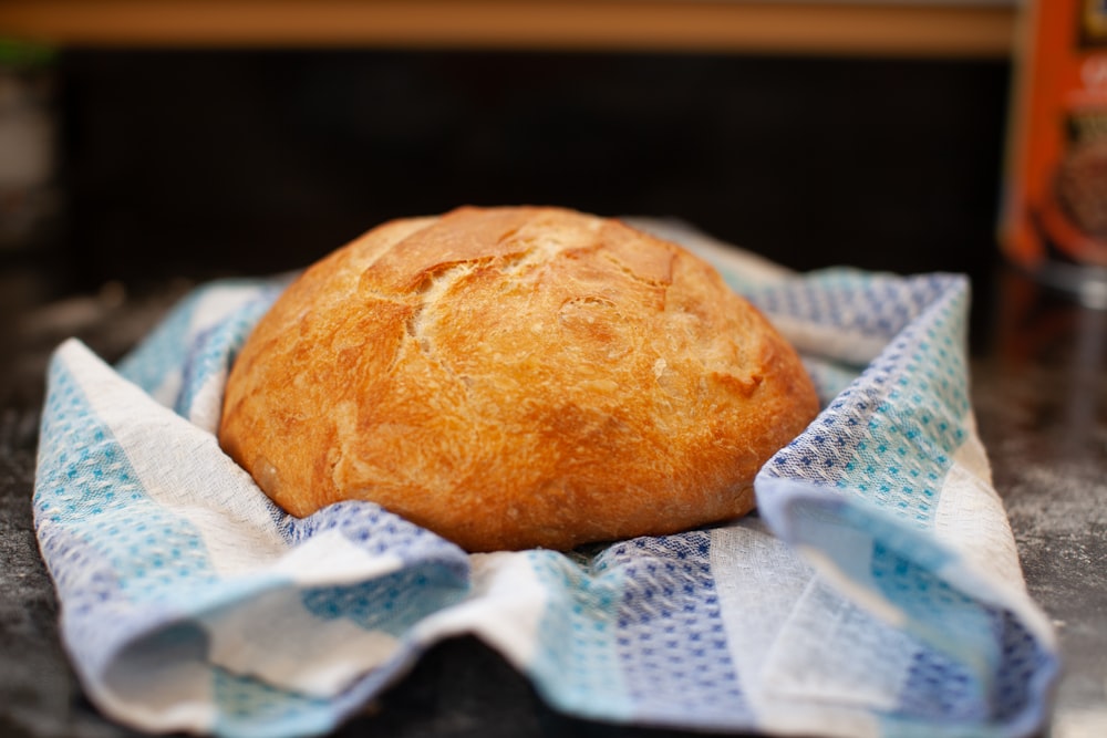 bread on white and blue textile