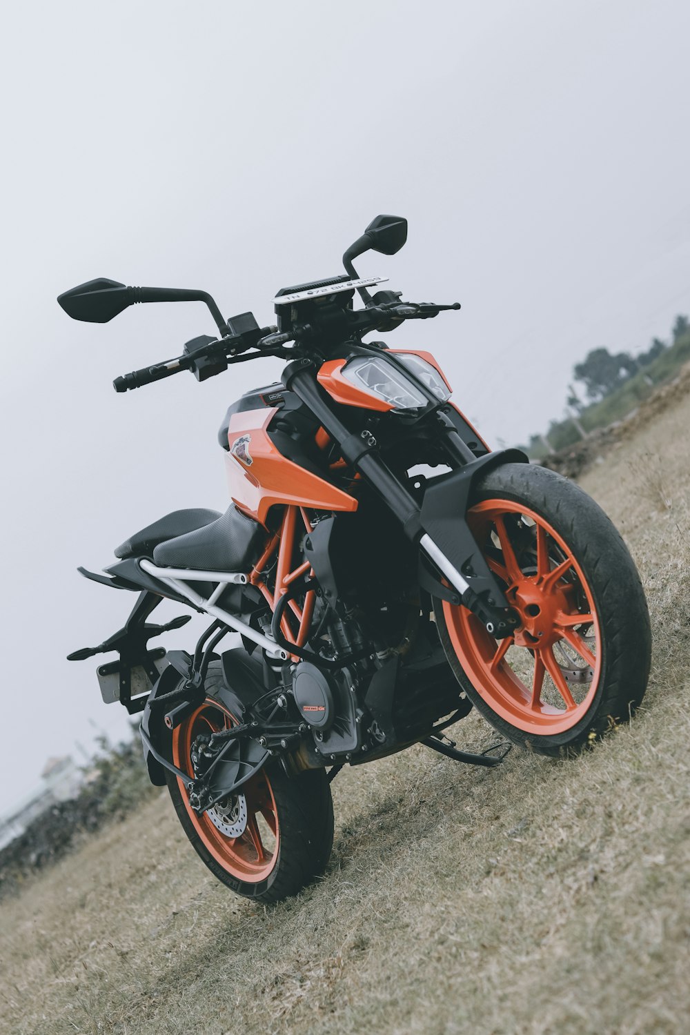 orange and black sports bike