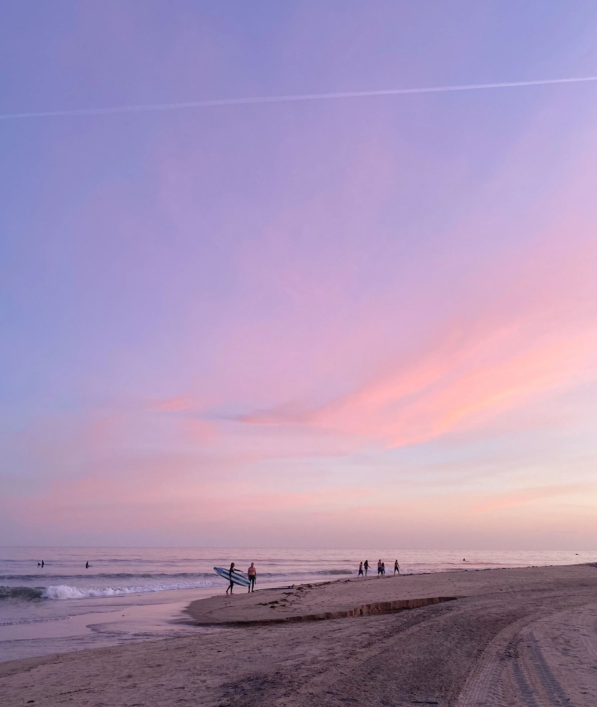 people walking on beach during daytime
