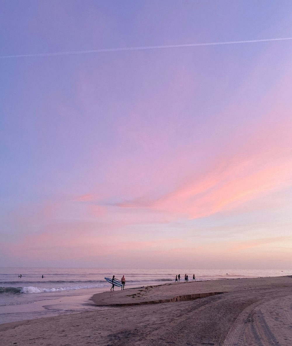 people walking on beach during daytime