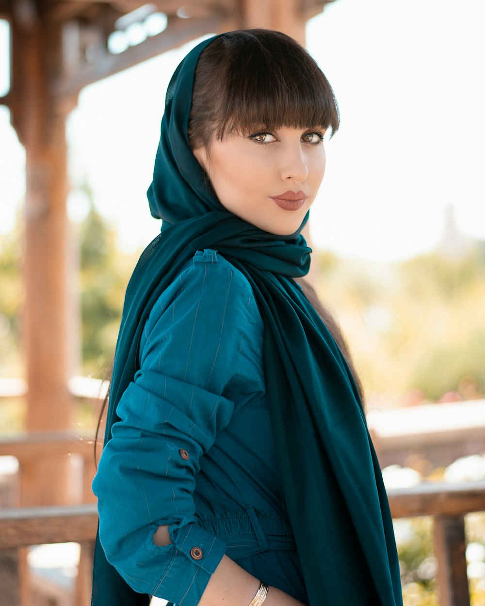 woman in blue hijab and blue long sleeve shirt