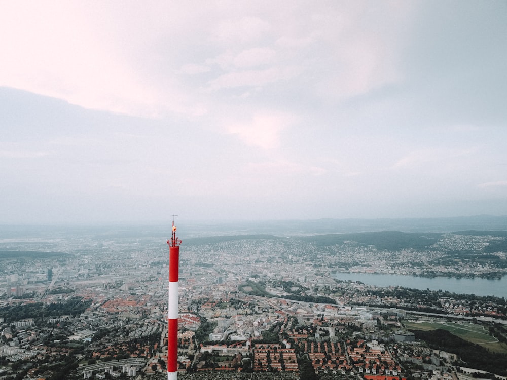 red and white tower on top of the building