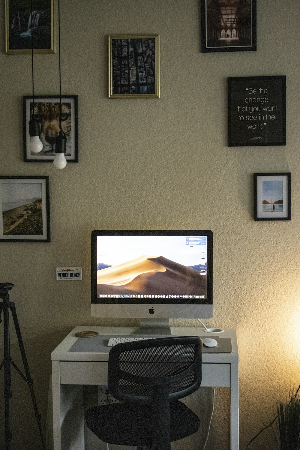 black flat screen tv turned on near white printer