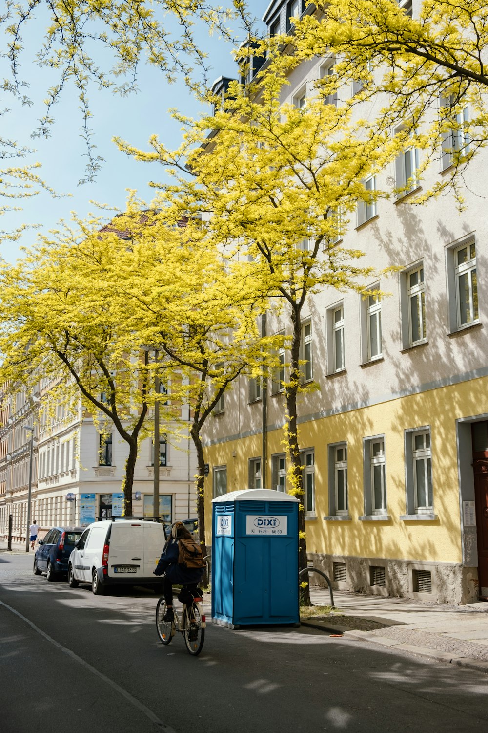 cars parked beside building during daytime