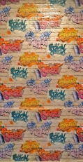 A vibrant graffiti mural covers a brick wall. Various words like 'Spray', 'Street', and 'Swag' are depicted in bright colors, including yellow, pink, blue, orange, and green, with artistic flair and dynamic styles. The background features a realistic brick texture with splashes of color surrounding the text.