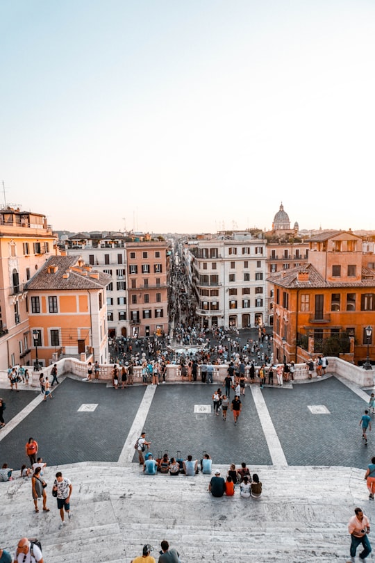 people walking on street near buildings during daytime in Spanish Steps Italy