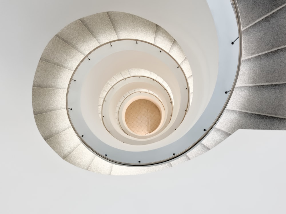 white spiral stairs with white ceiling