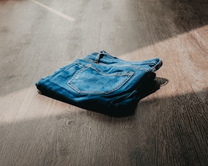 blue textile on brown wooden table