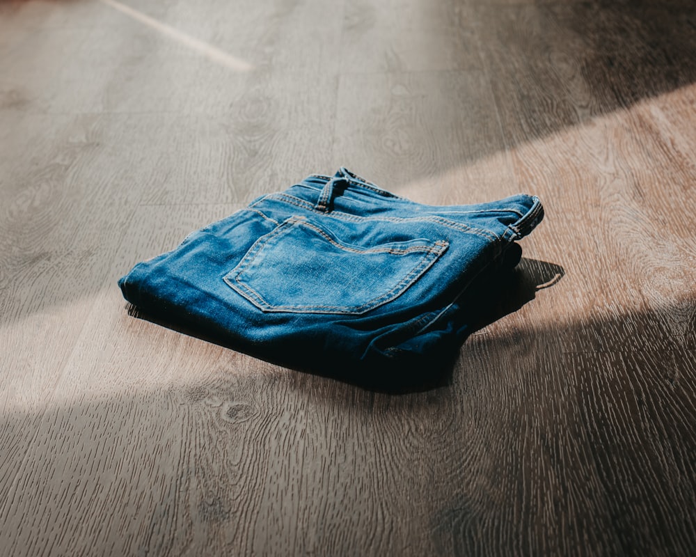 blue textile on brown wooden table