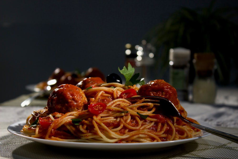 spaghetti on white ceramic plate