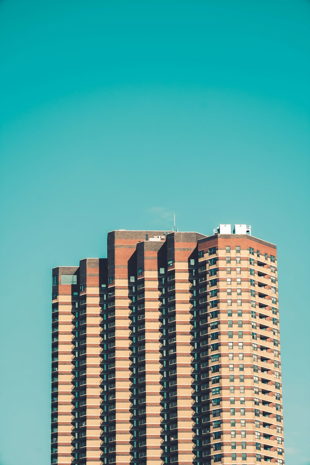 blue and white concrete building under blue sky during daytime