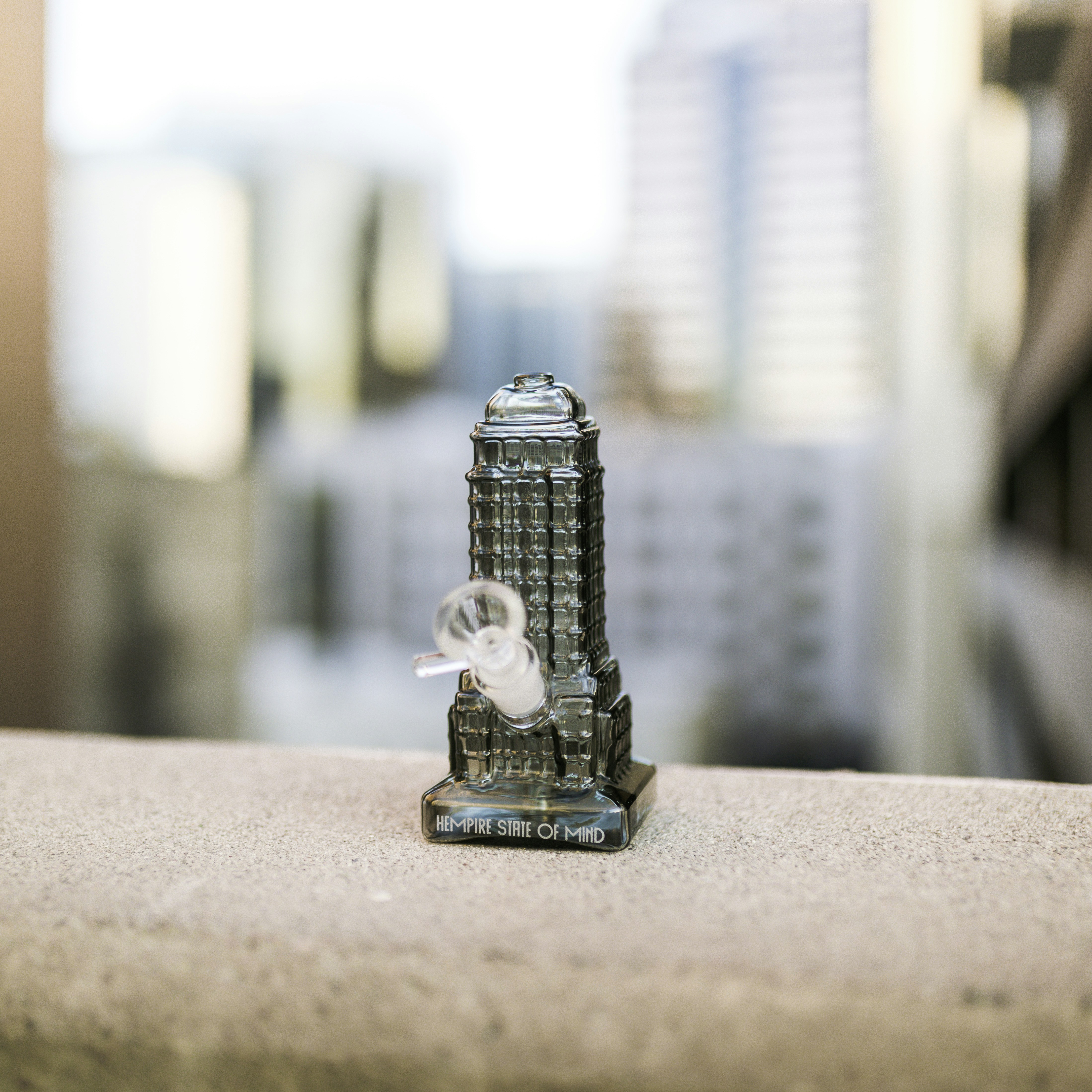 silver lego toy on brown table