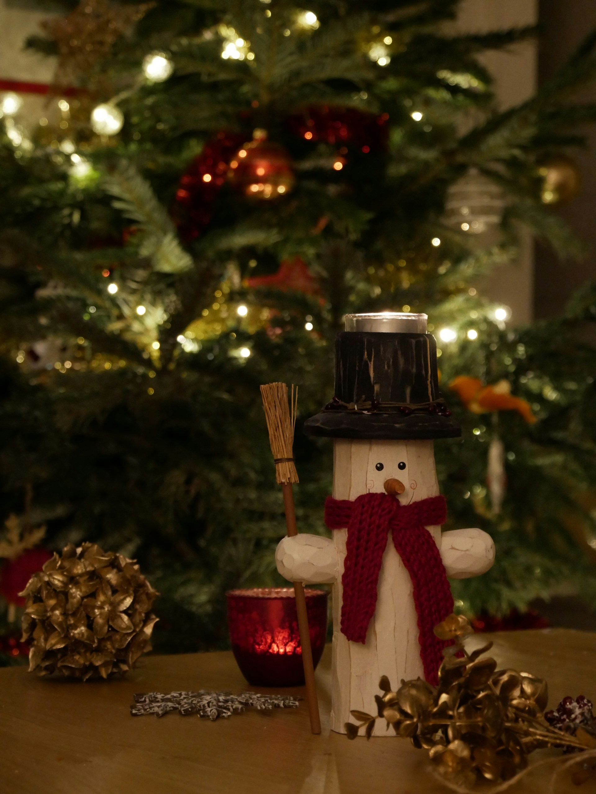 brown and white angel figurine on brown wooden table