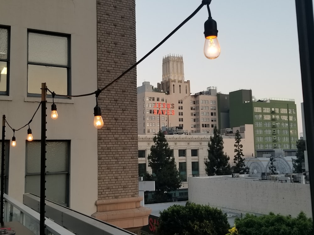 black street light near brown concrete building during daytime