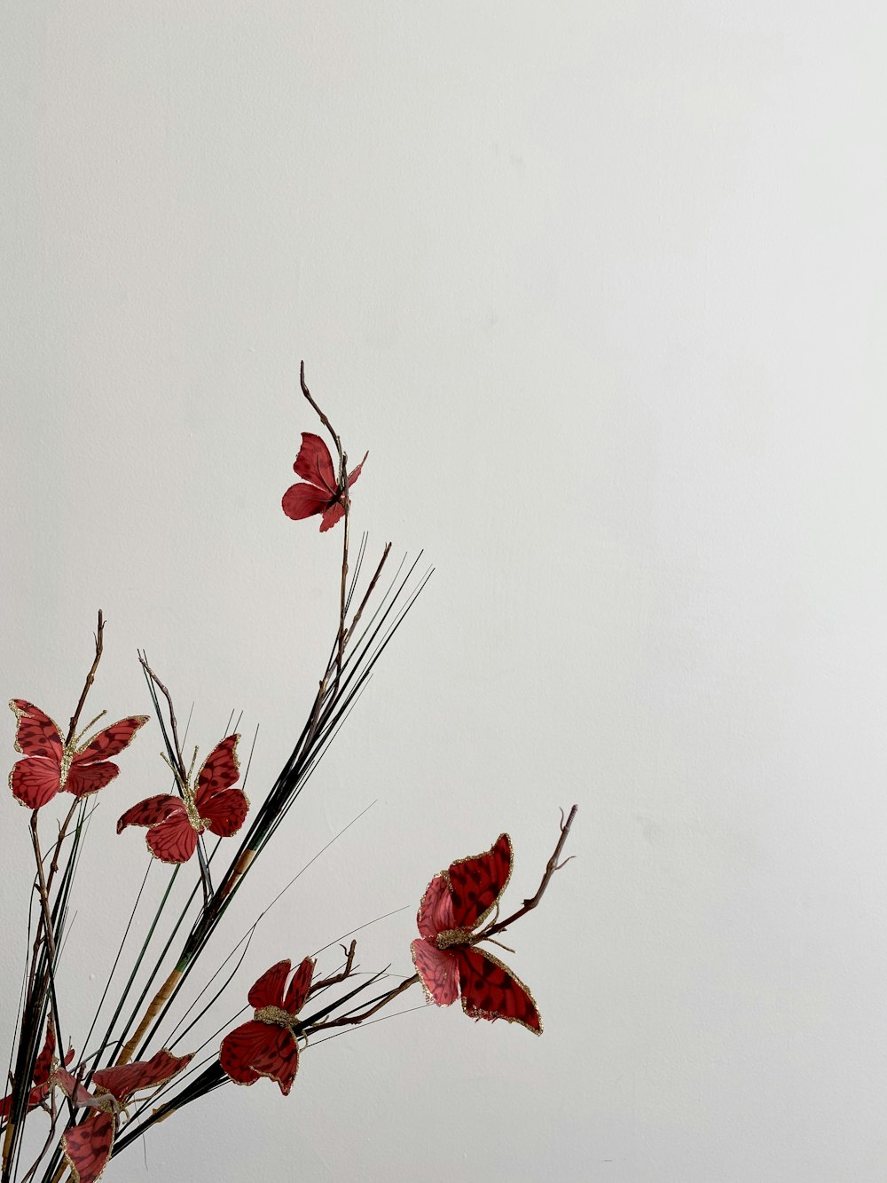 red flowers with green leaves