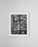 Elegant canvas print of abstract cityscape with rich gold accents displayed in a modern interior.