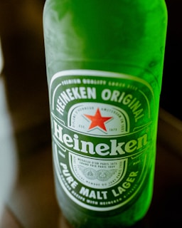 A close-up of a refreshing Heineken bottle.