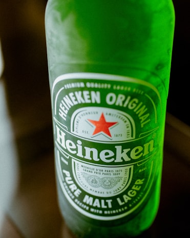 A close-up of a refreshing Heineken bottle.