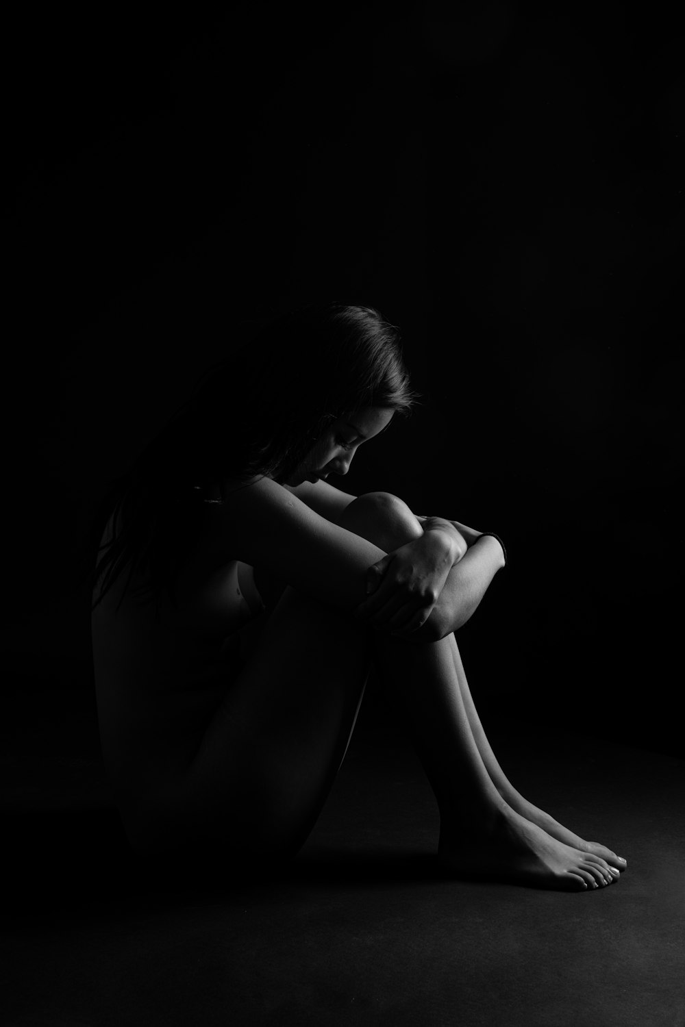 grayscale photo of woman in black tank top