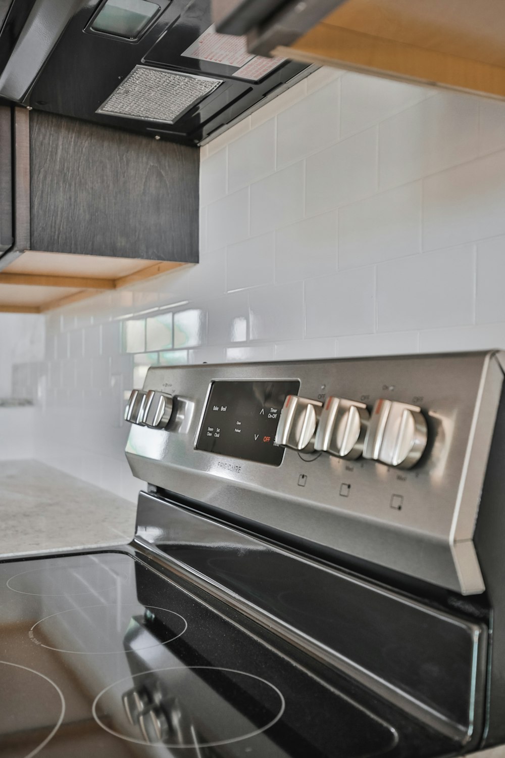 a stove top oven sitting inside of a kitchen