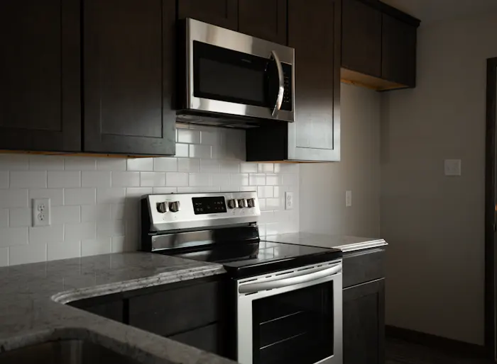 Built-in microwave in a modern kitchen, the type our Marlton technicians repair