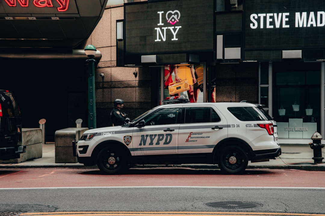 white and black police car on road