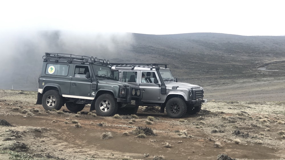 white jeep wrangler on brown field during daytime