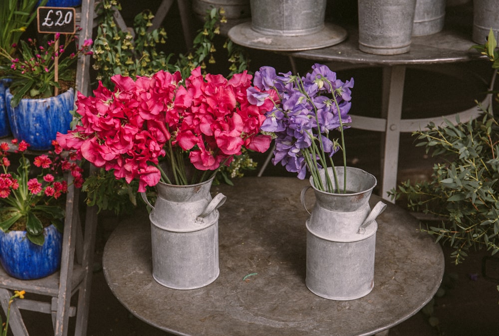 red flowers in gray concrete pot