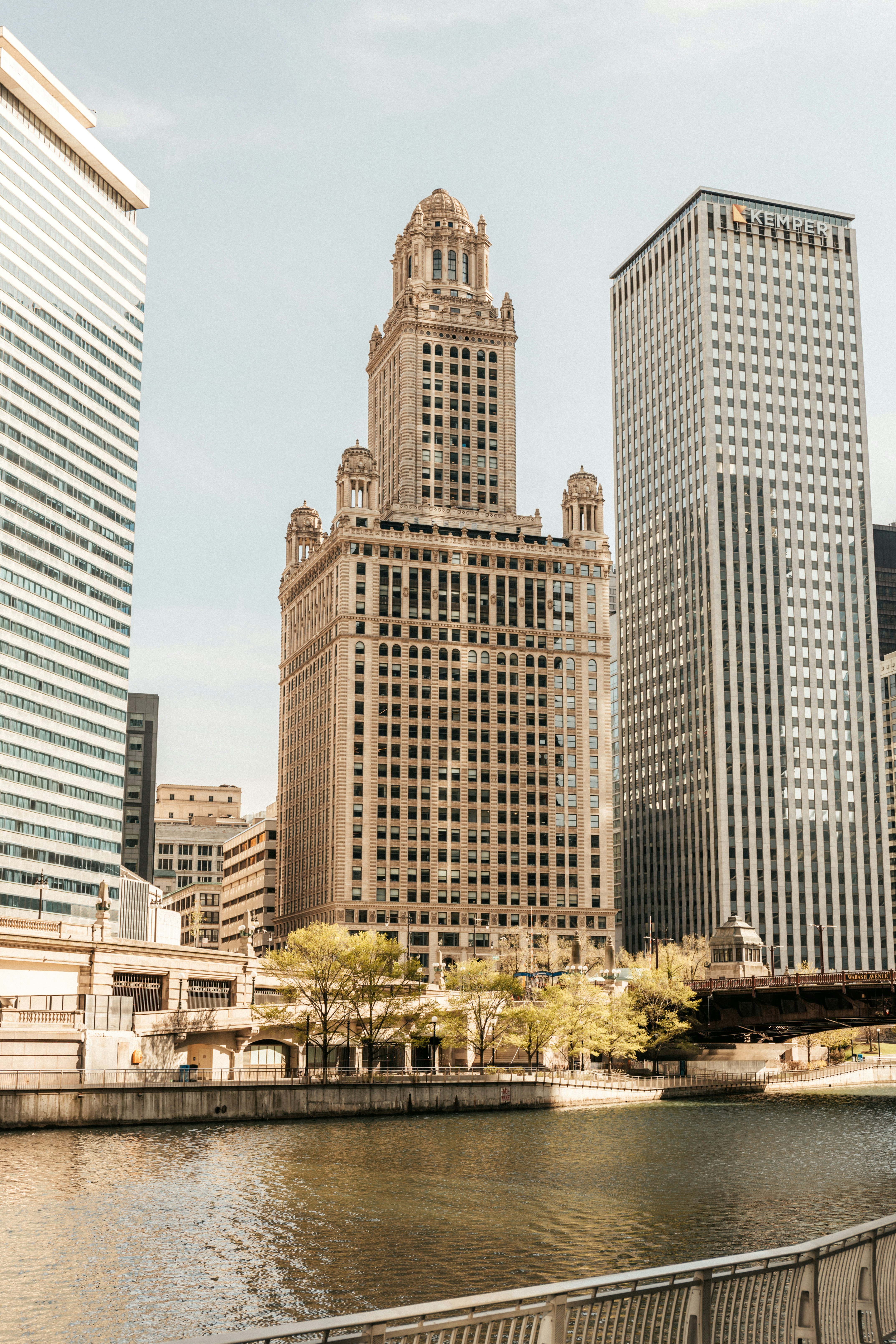 white concrete building near green trees during daytime